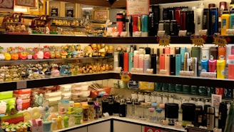 assorted bottles on glass shelf