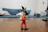 A happy young man holding a detailed anime figure from Dalys Toys collection.