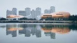 white and brown building near body of water during daytime