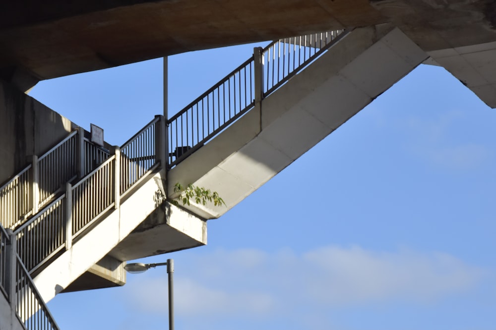 black metal railings under blue sky during daytime