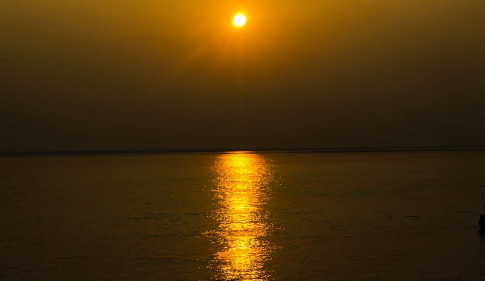 body of water during sunset