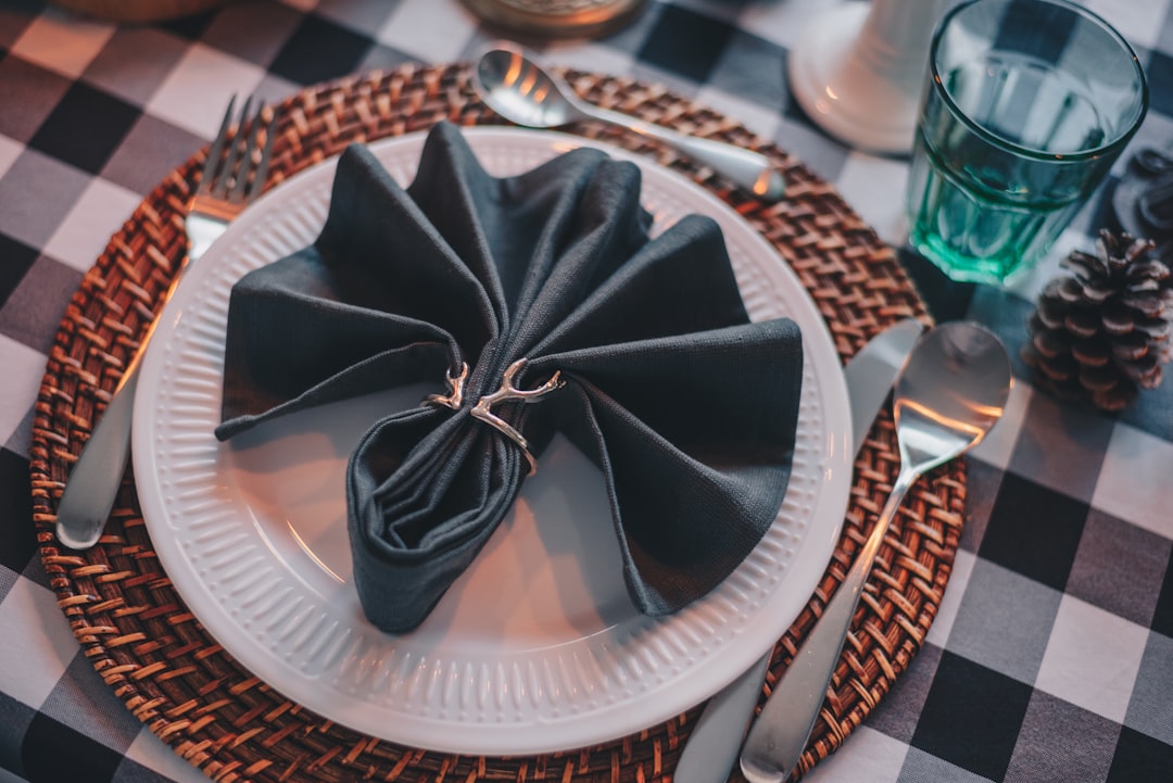 black and white paper boat on white round plate
