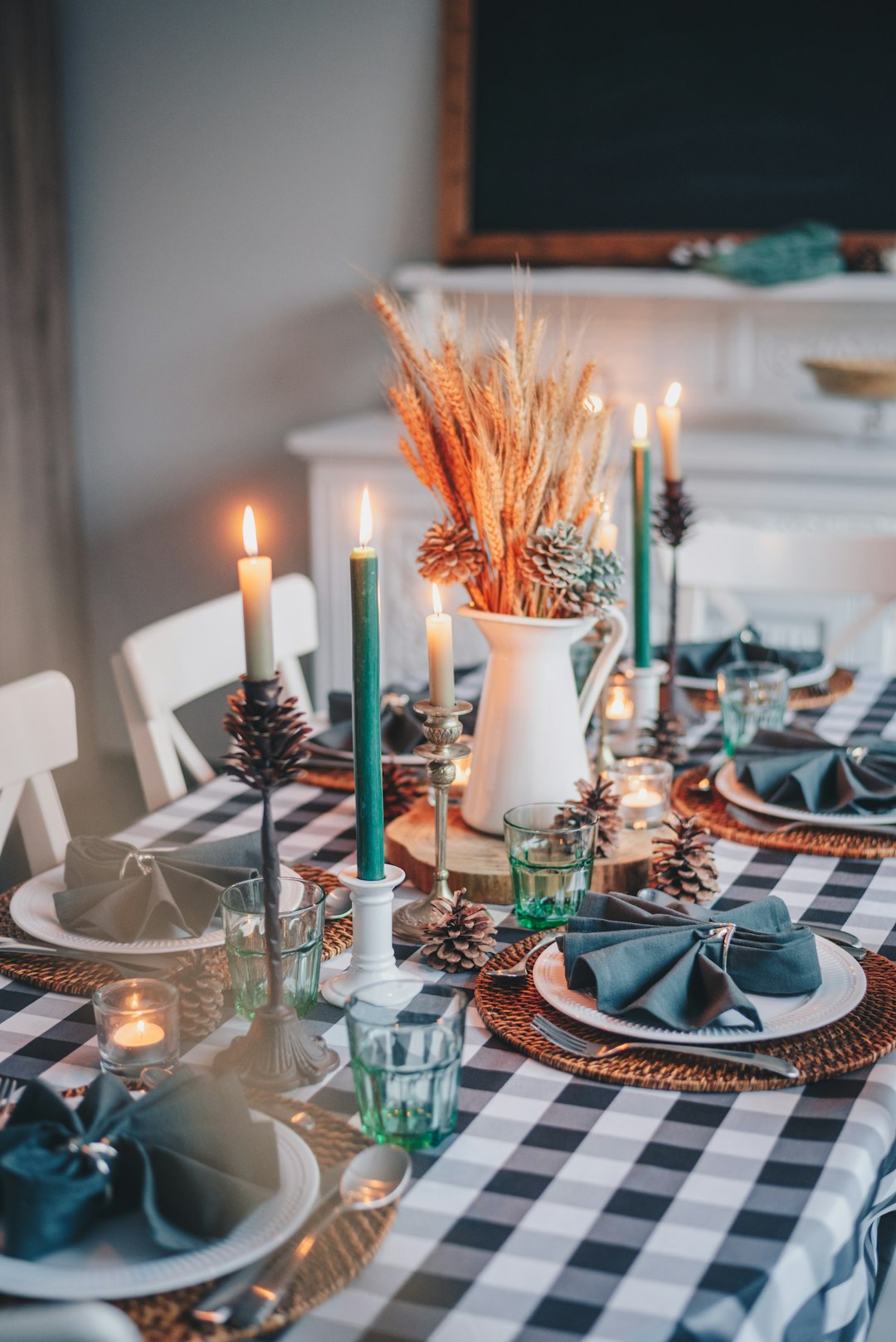  white candles on brown wooden table tablecloth