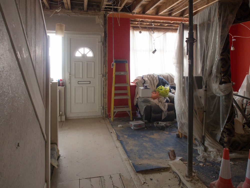 white wooden door near white plastic bag