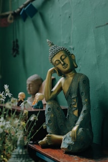 woman in green dress figurine