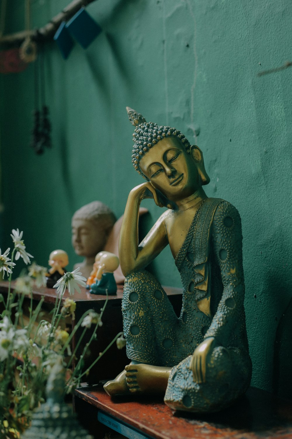 woman in green dress figurine