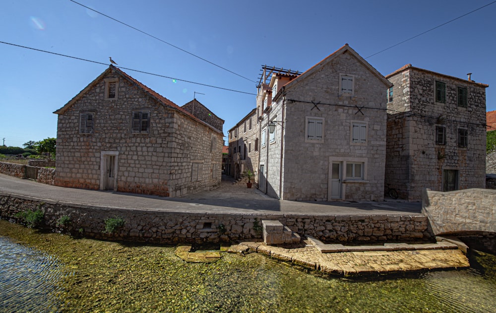 brown brick building near green grass field during daytime