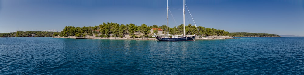 white and black boat on sea during daytime