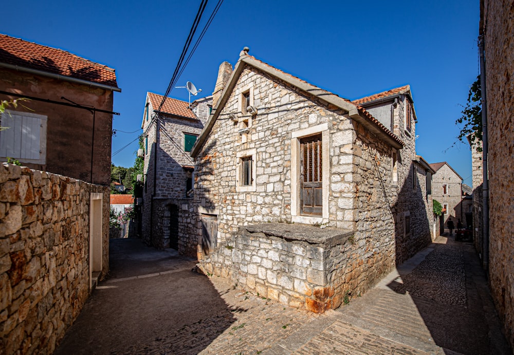 white and brown concrete house under blue sky during daytime