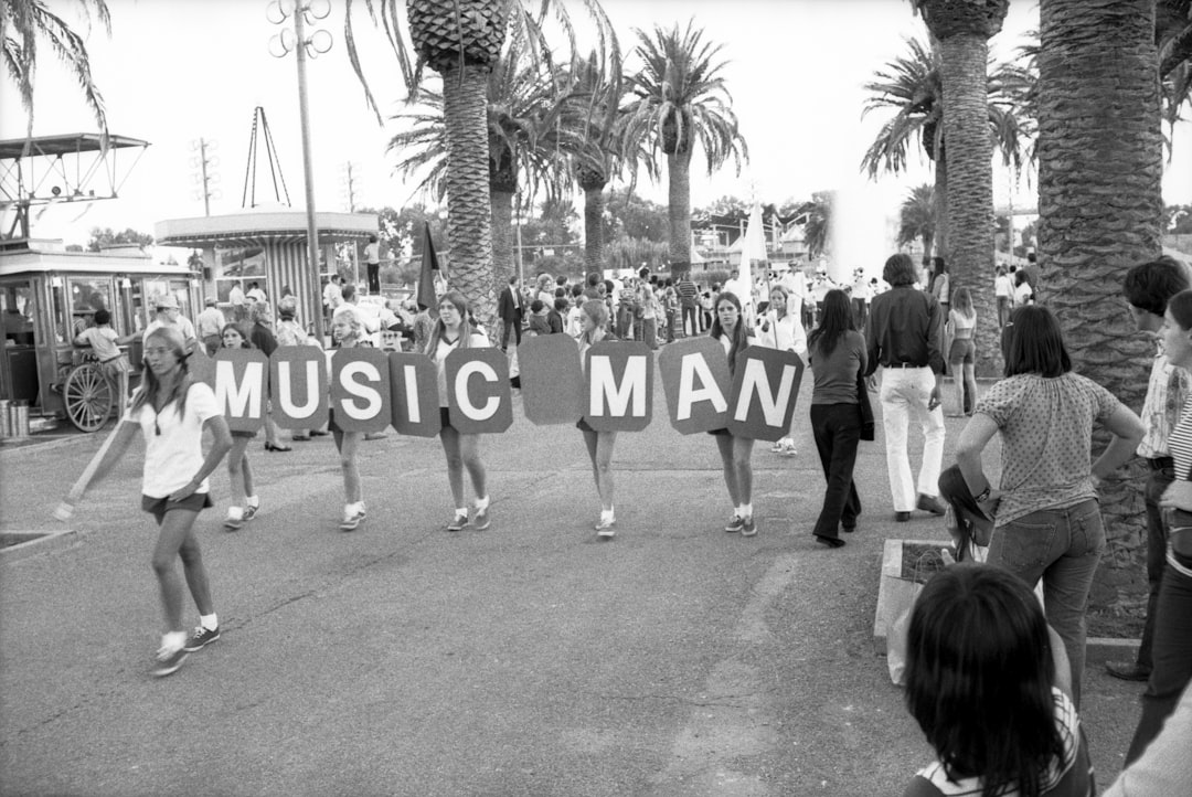 grayscale photo of people walking on street, California State Fair 1973