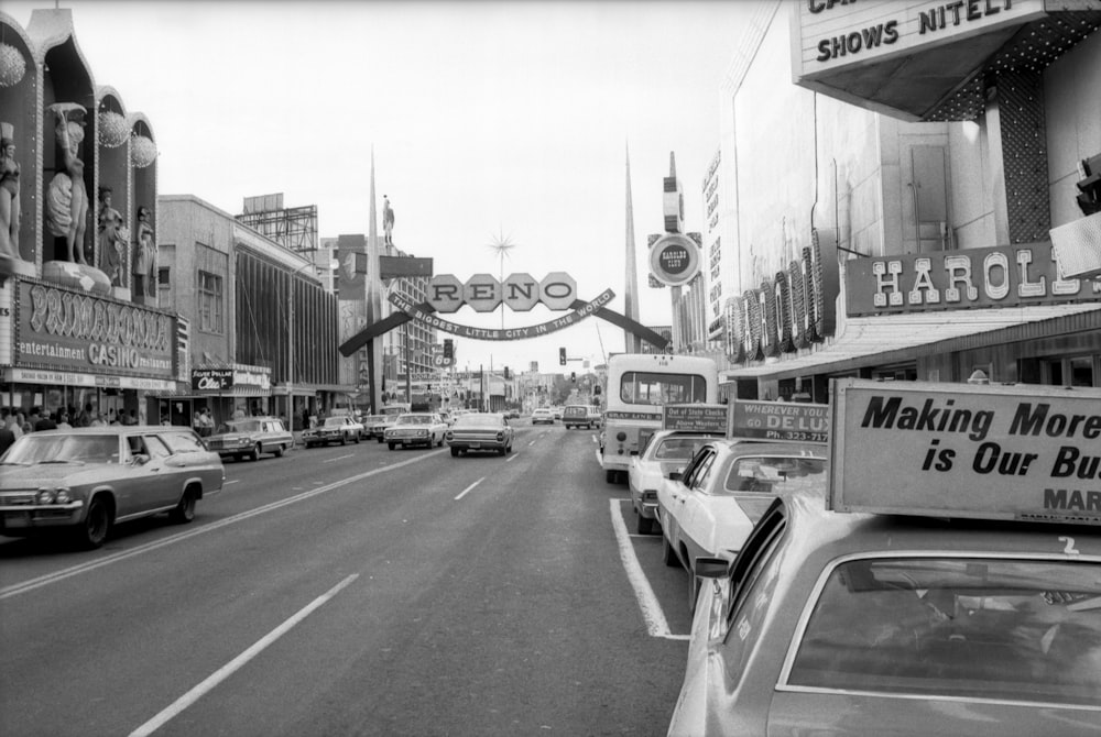 grayscale photo of cars on road