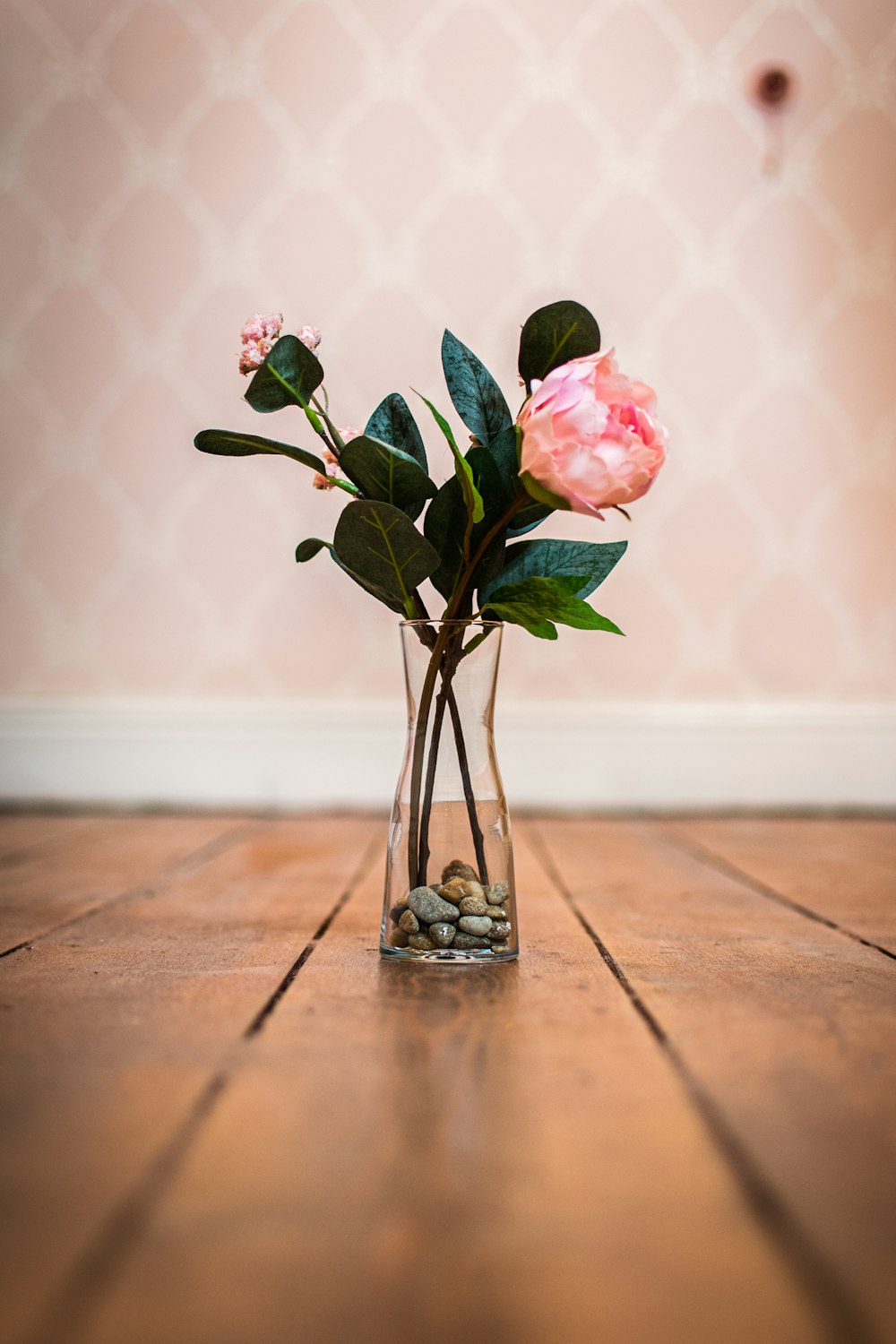 pink roses in clear glass vase