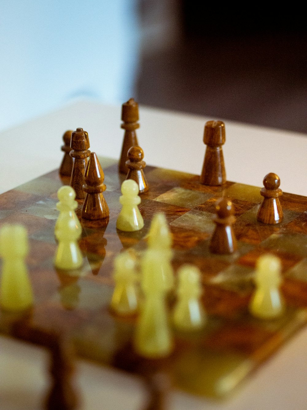 brown wooden chess piece on brown wooden chess board