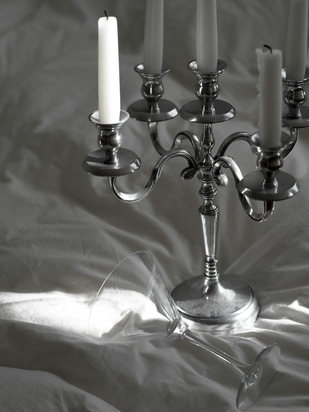 white candles on silver candle holder