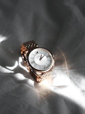 silver and white analog watch