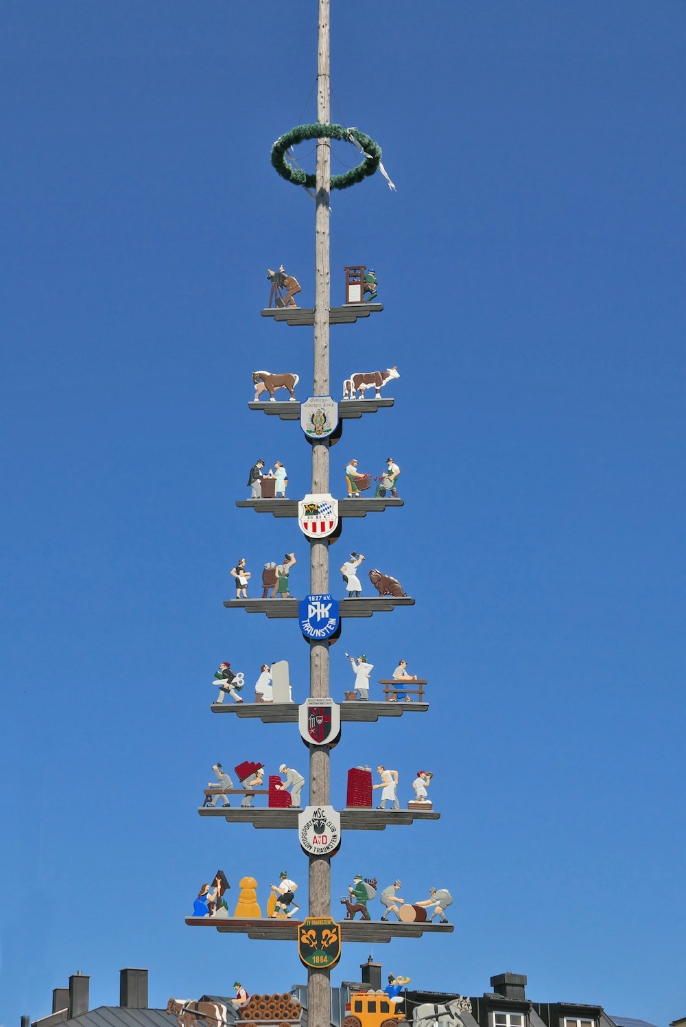 a very tall pole with a bunch of signs on it