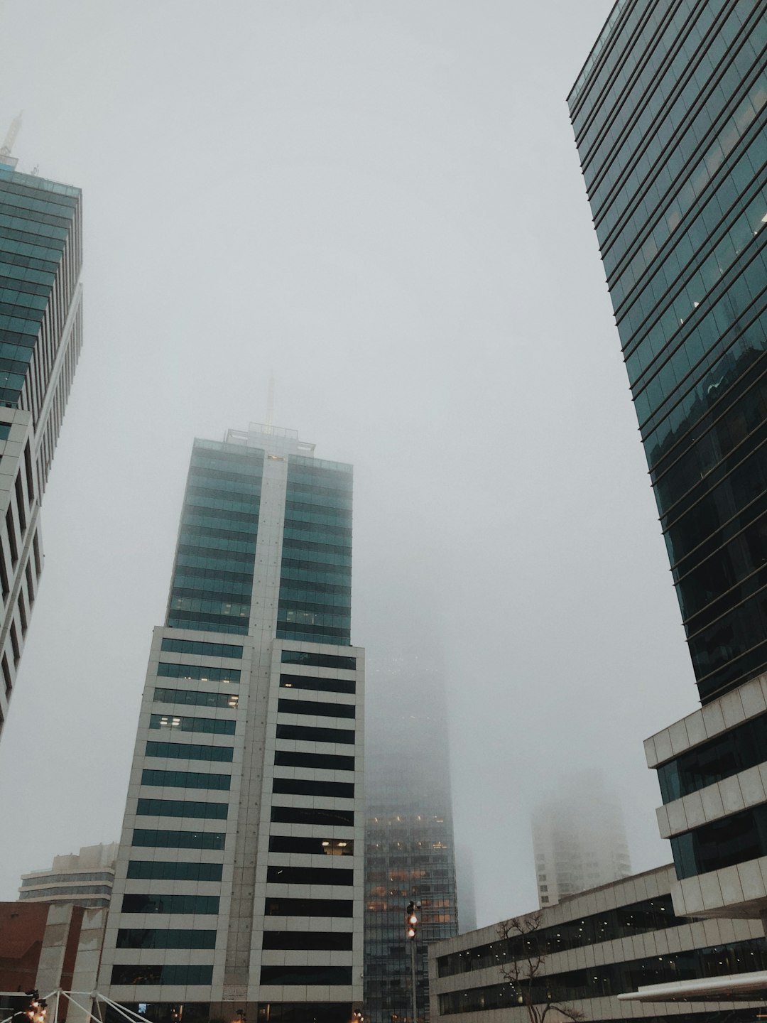 high rise buildings under white sky during daytime