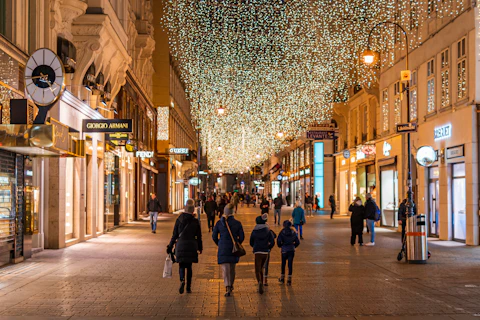 people walking on street during night time
