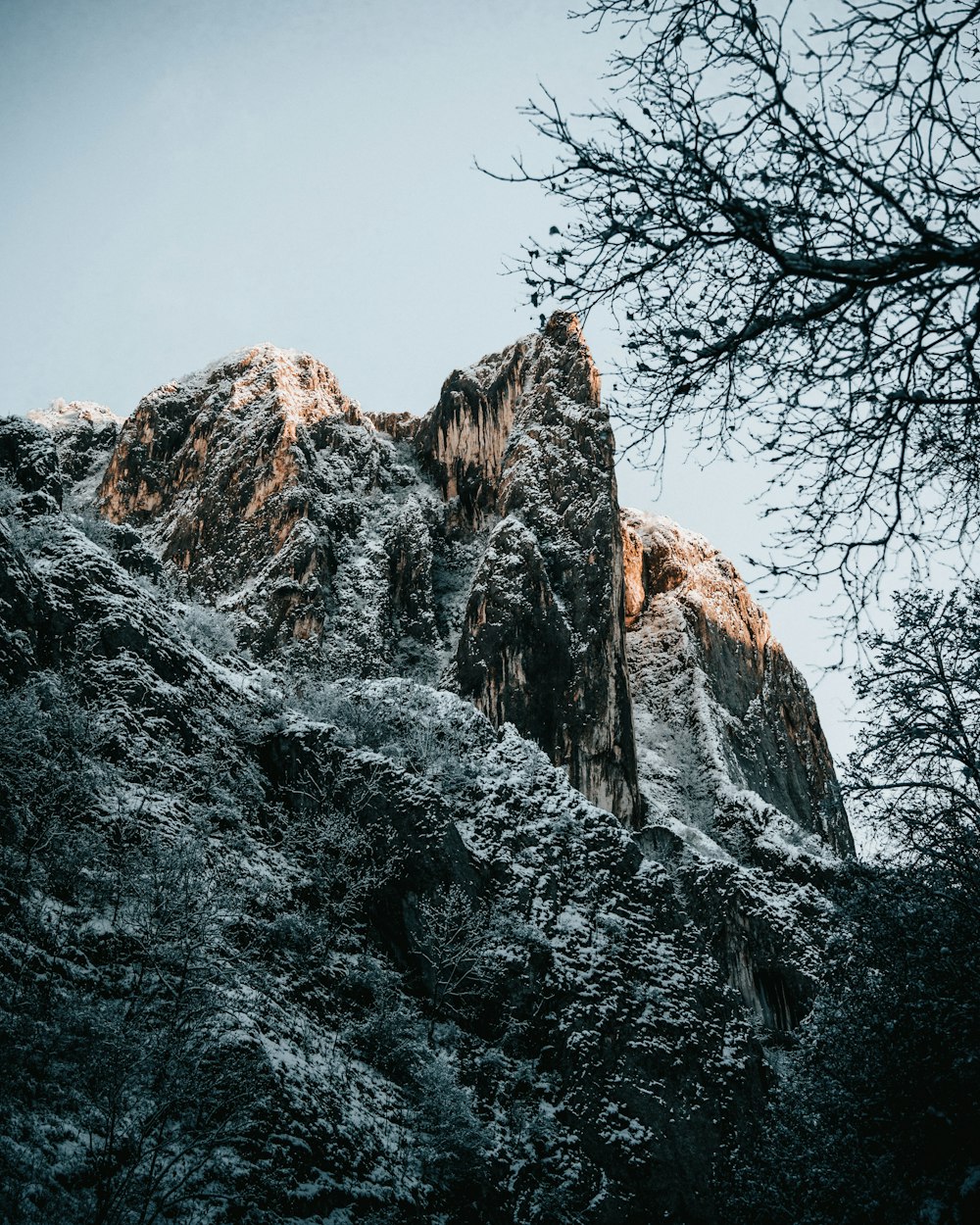 brown rocky mountain under blue sky during daytime