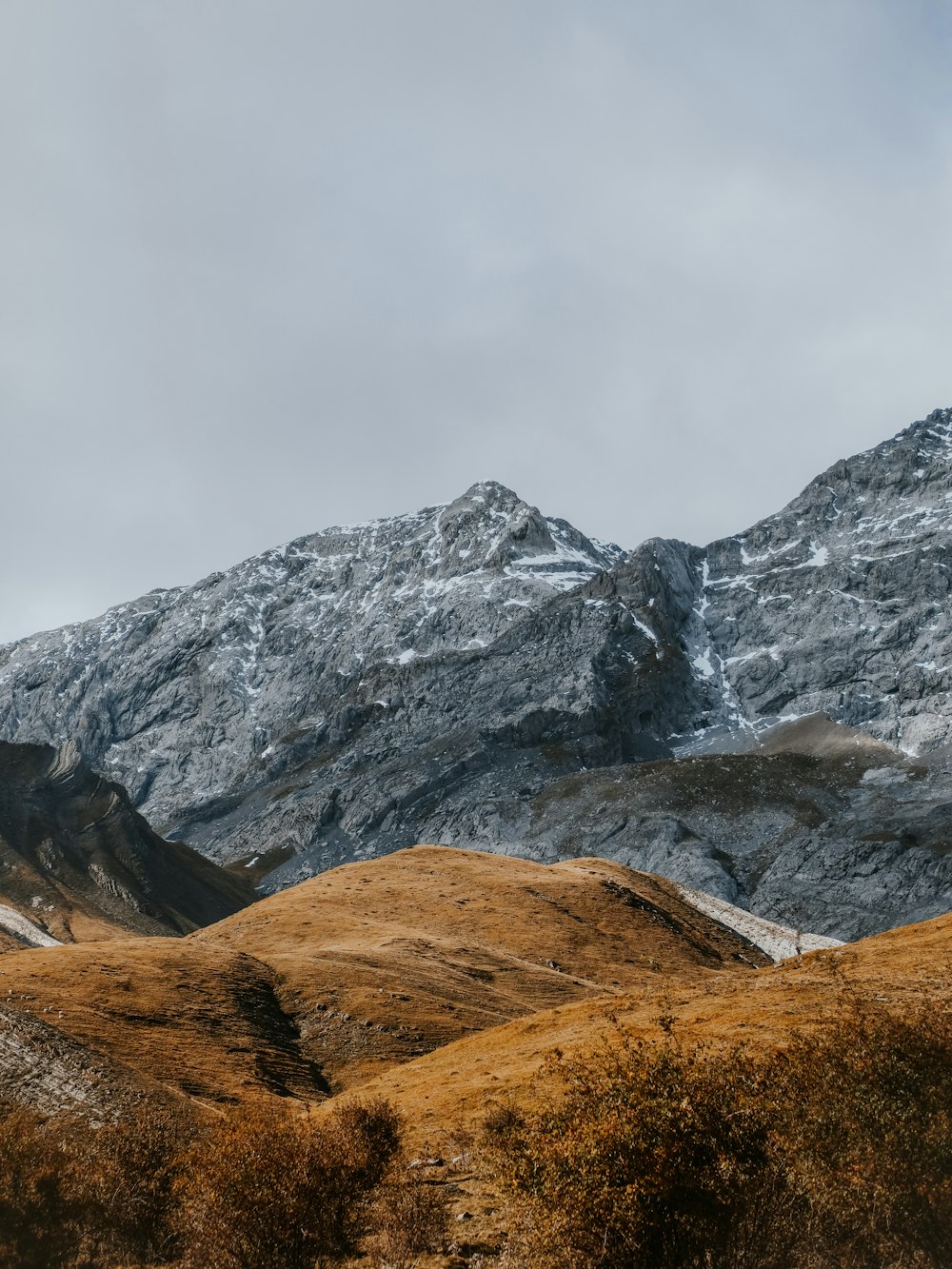 gray rocky mountain under white sky during daytime