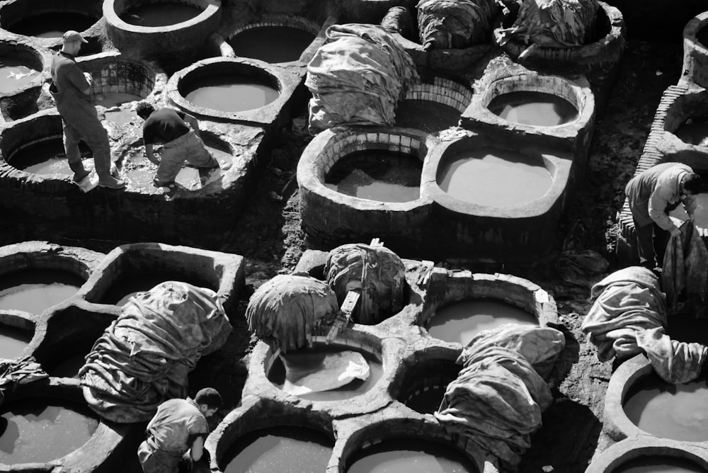 grayscale photo of clay pots