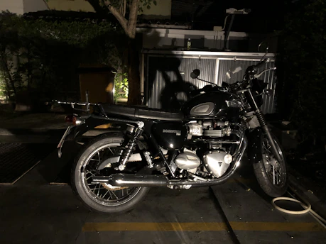 A classic vintage motorcycle with polished chrome details under soft daylight.