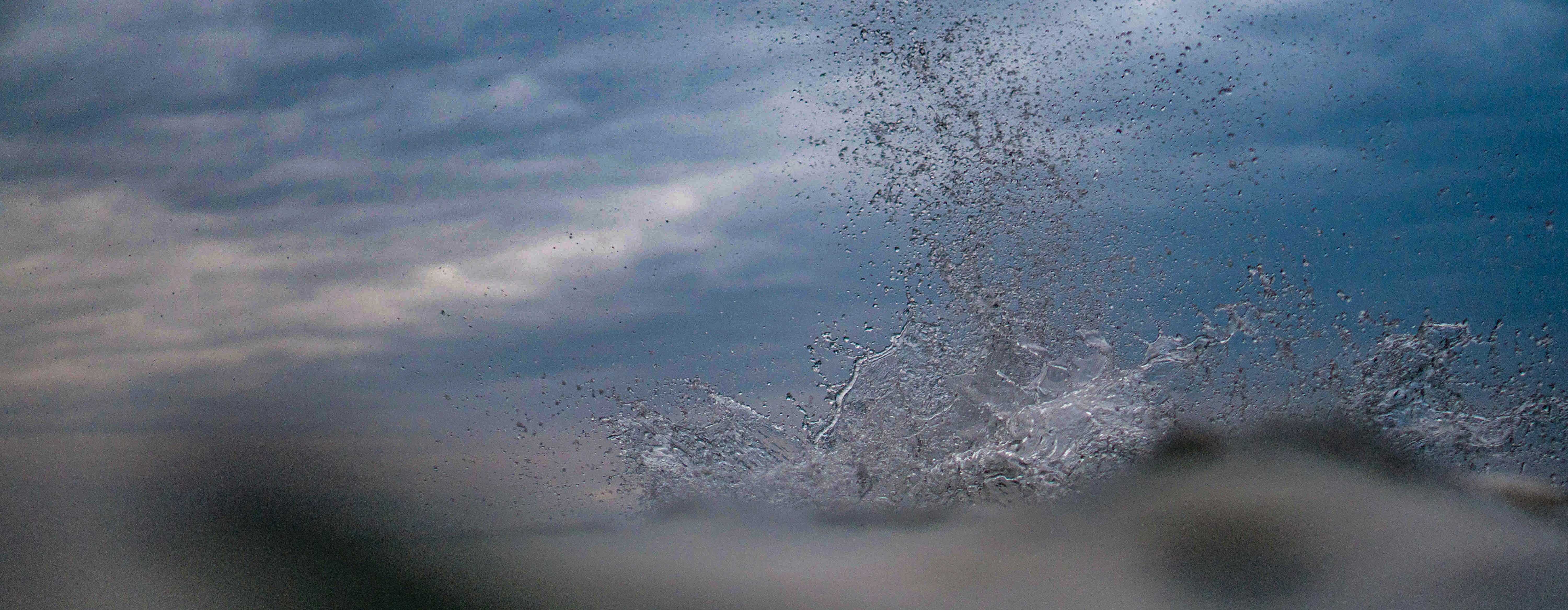 white clouds over ocean during daytime