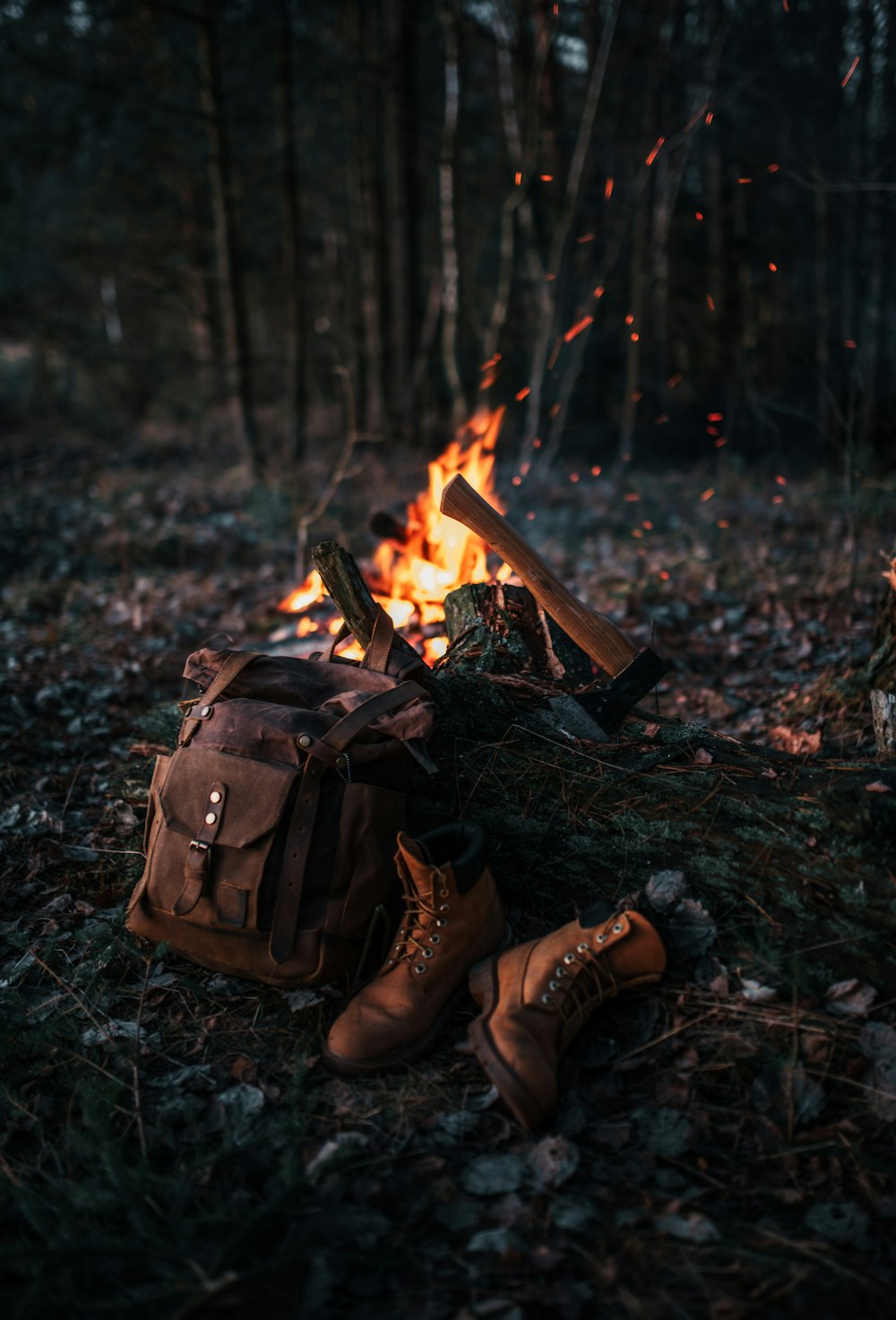 brown leather boots on brown dried leaves