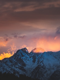 A stunning landscape photograph showcasing mountains at sunset.