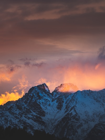 A stunning landscape photograph showcasing mountains at sunset.