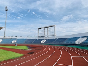 white and blue stadium under blue sky during daytime