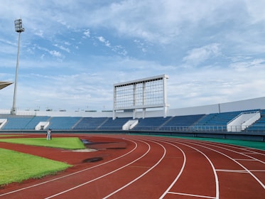 white and blue stadium under blue sky during daytime