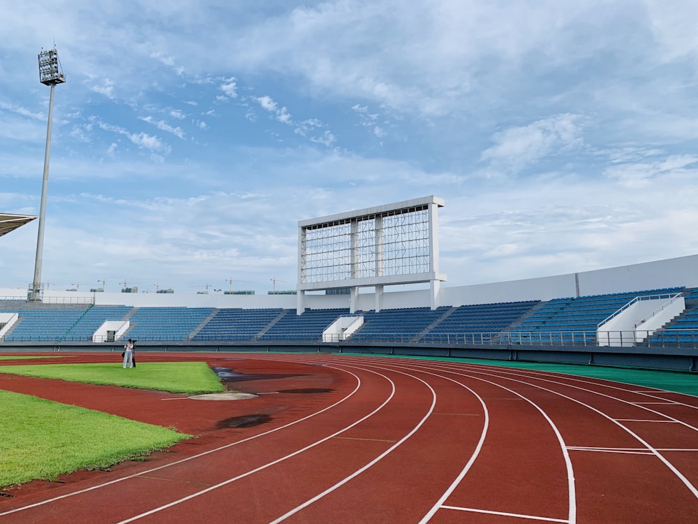 white and blue stadium under blue sky during daytime