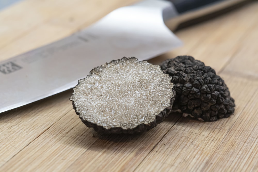 black and gray round ornament on brown wooden table