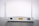 A white Wi-Fi router with two antennas positioned vertically. The router is seen from the back, showing ports and connectors including Ethernet ports, a power switch, and a power input. The device is placed on a dark surface against a light background.