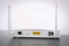 Close-up of a high-speed wireless router with signal indicators lit.