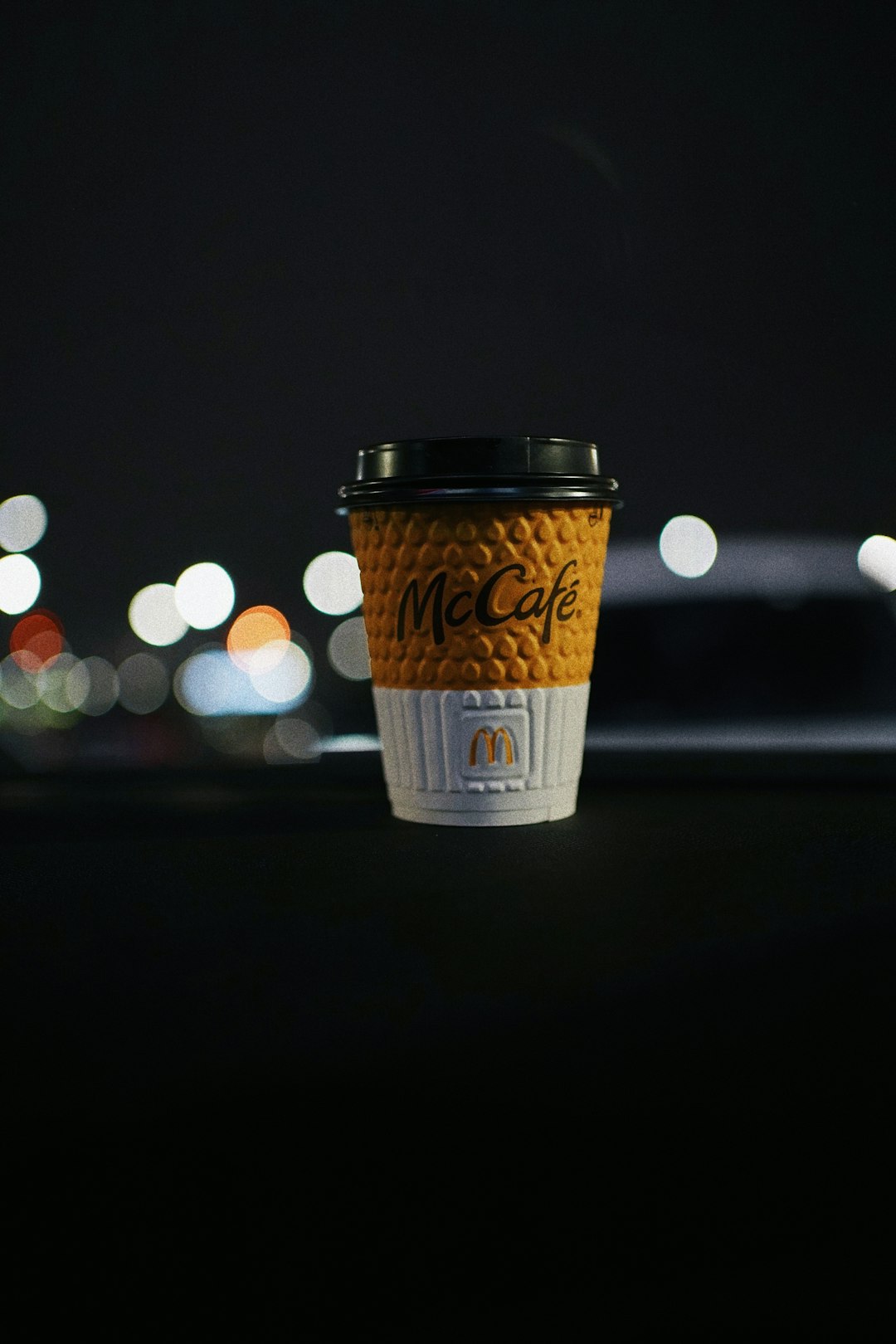 white and brown disposable cup