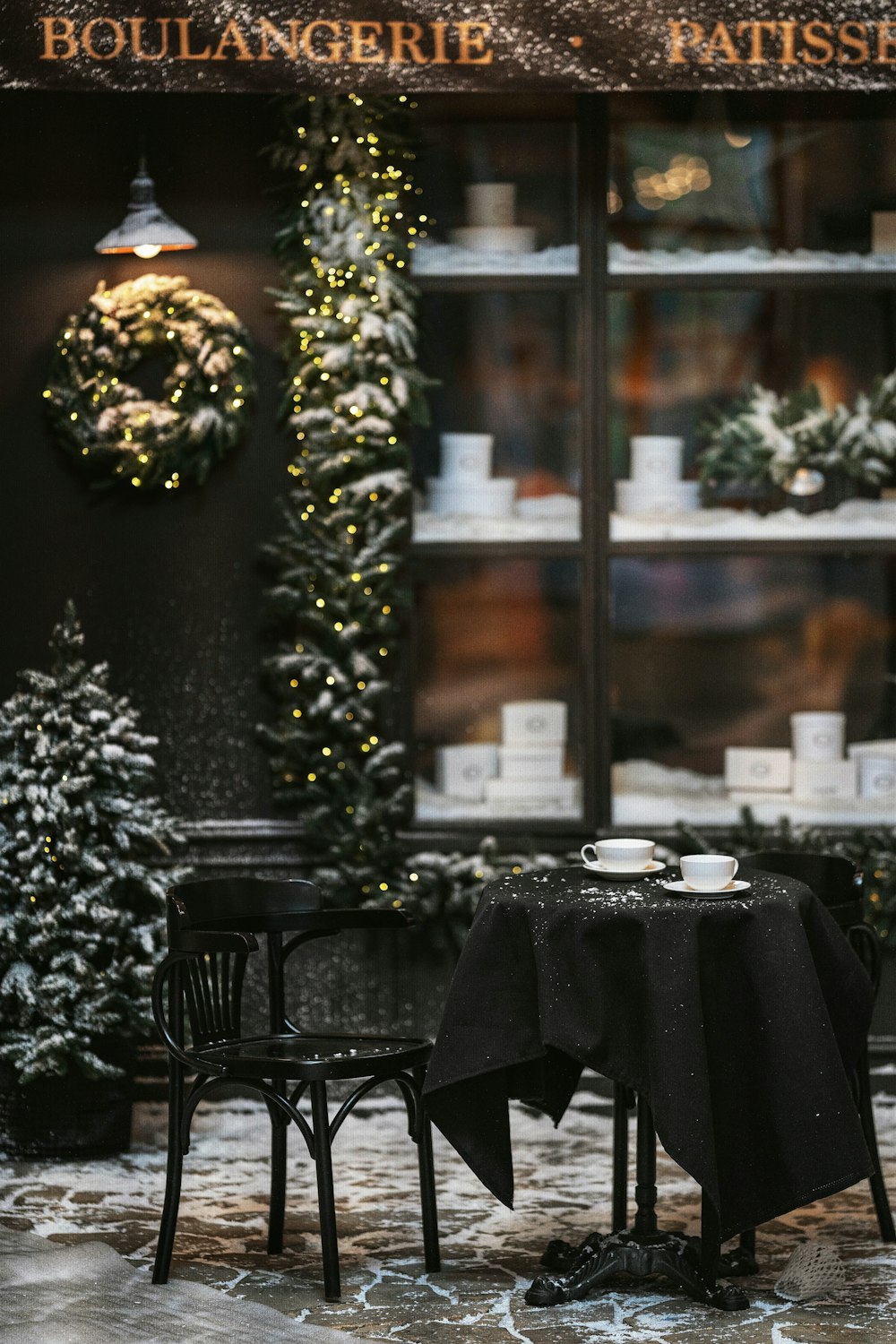 black table with chairs and table cloth