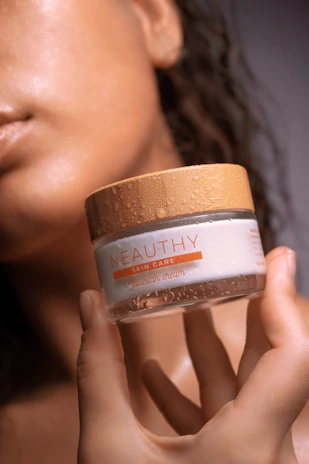 woman holding coconut oil bottle