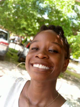 A smiling individual finishing a workday strong, full of energy and focus.