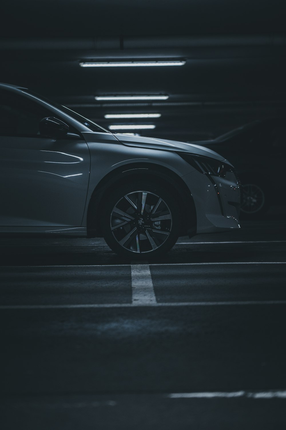 grayscale photo of car on road