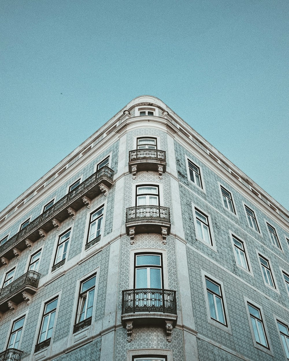 white concrete building under blue sky during daytime