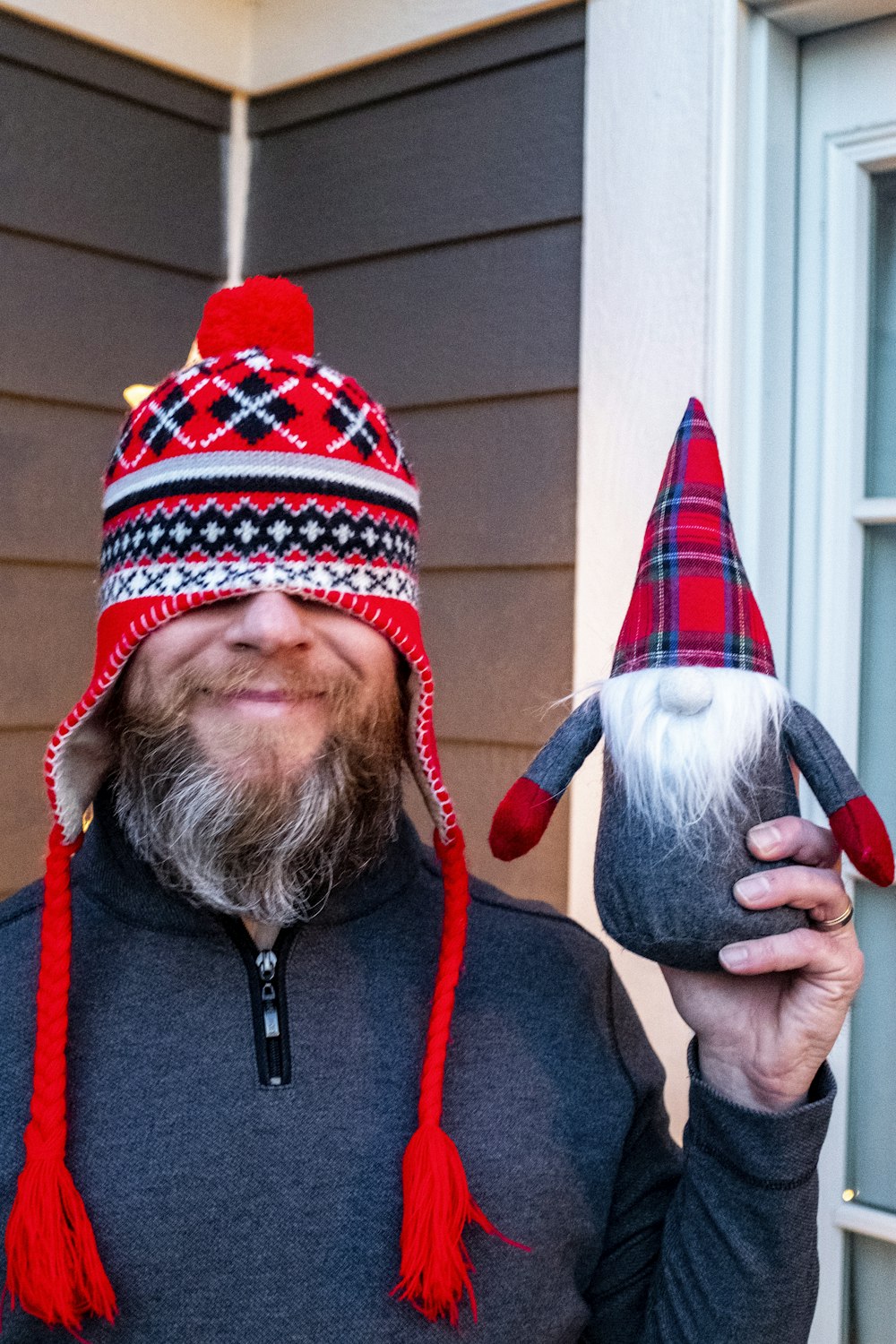 man in red and black knit cap