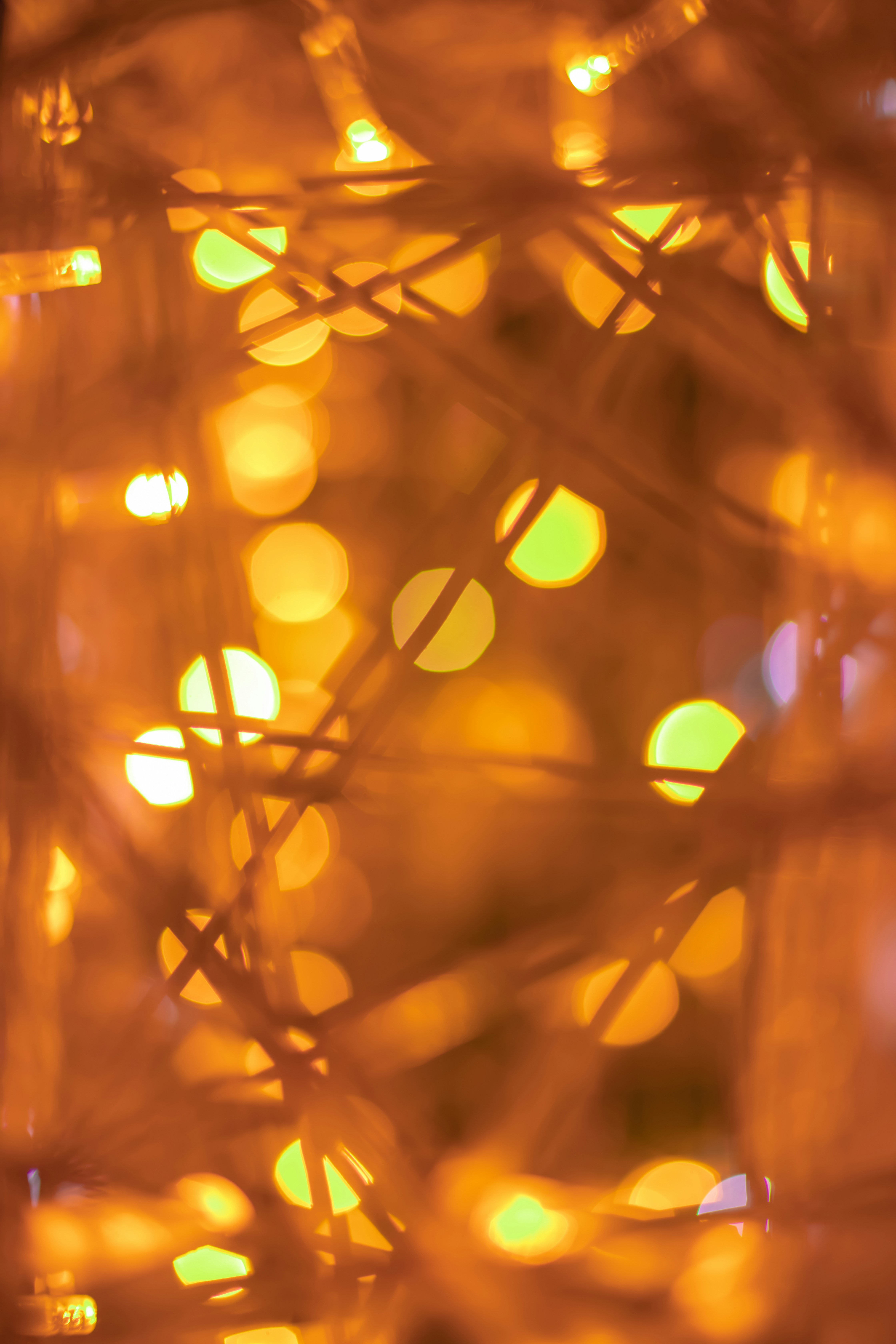 orange light bokeh on brown wooden surface