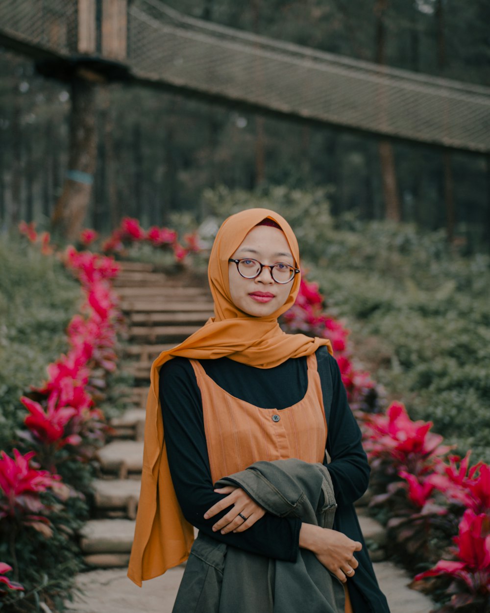 woman in brown hijab and black long sleeve shirt