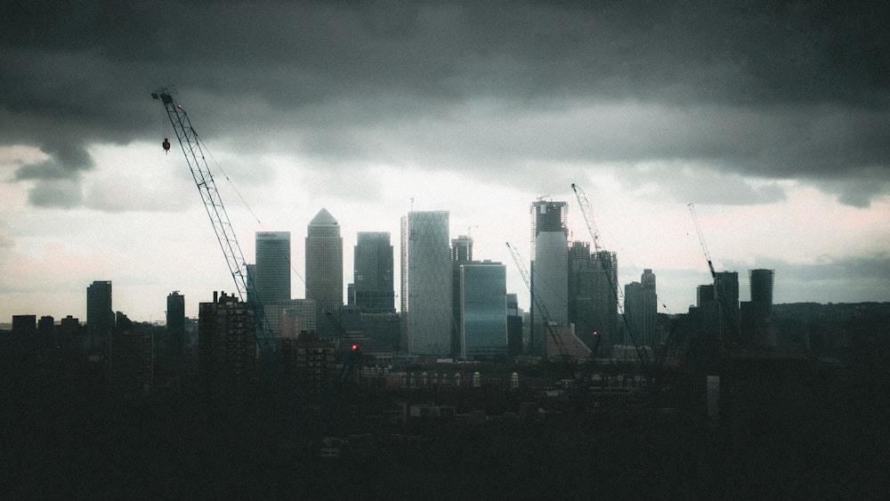 city skyline under gray cloudy sky during daytime