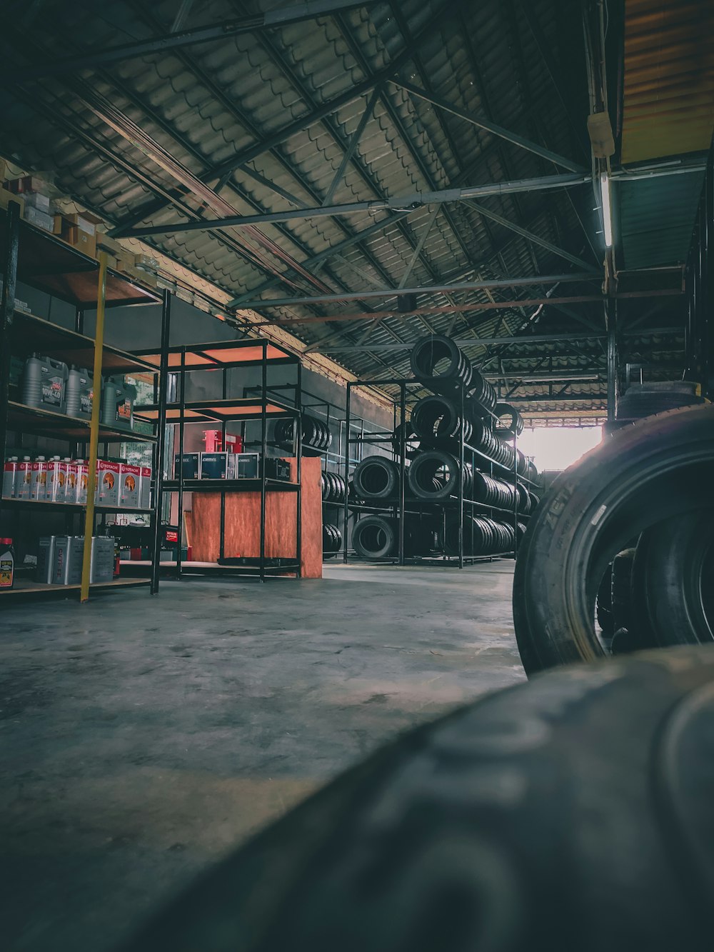 black car tire on brown wooden table