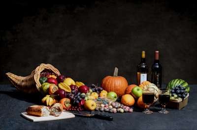 pumpkin and bottles on table cornucopia teams background