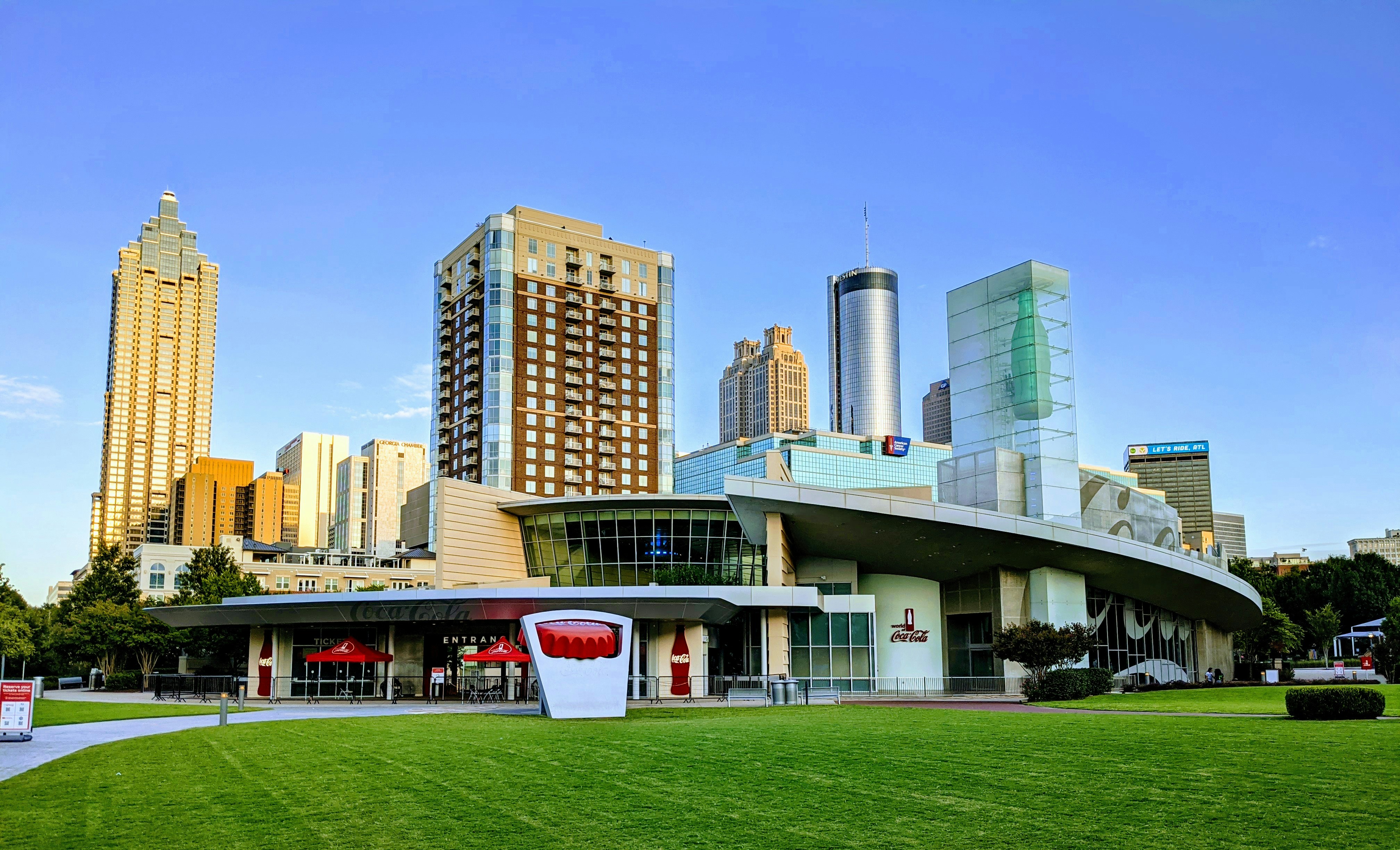 a large building with a green lawn in front of it, Atlanta Downtown 