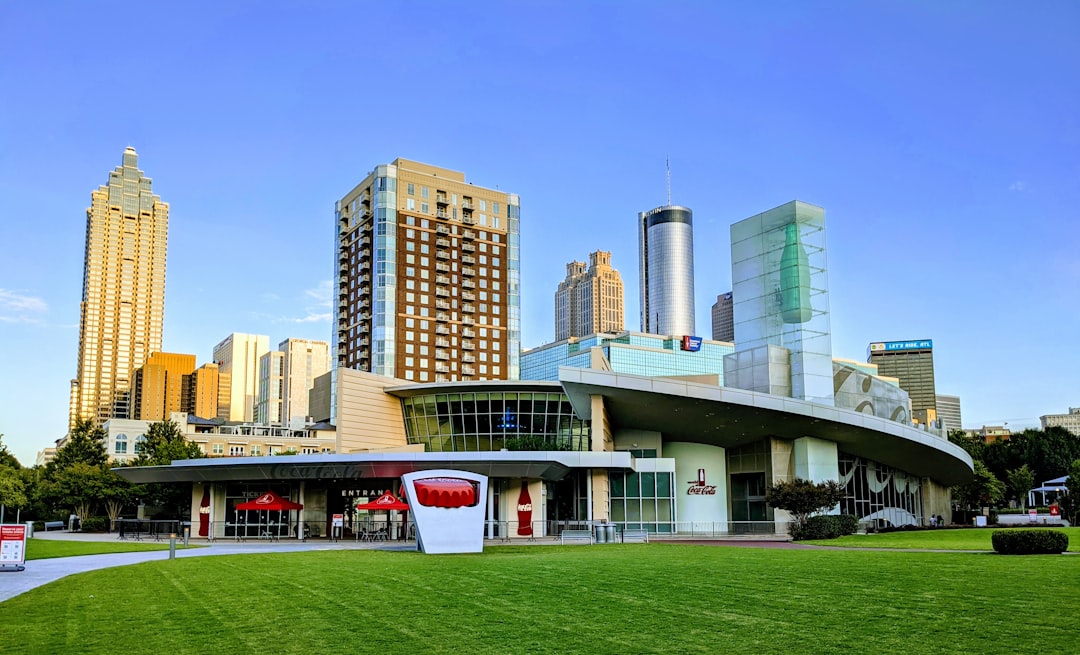 a large building with a green lawn in front of it, Atlanta Downtown